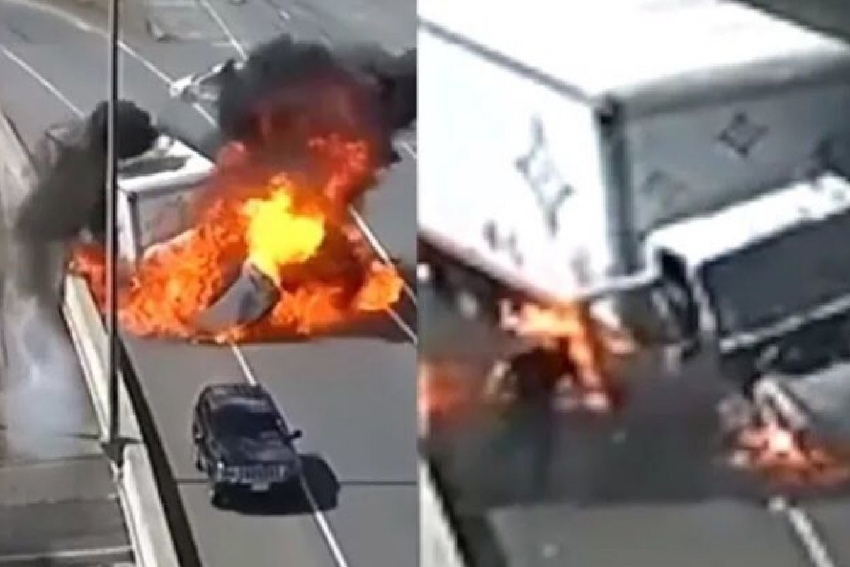 Caminhão é atingido por carro, explode e motorista sai andando