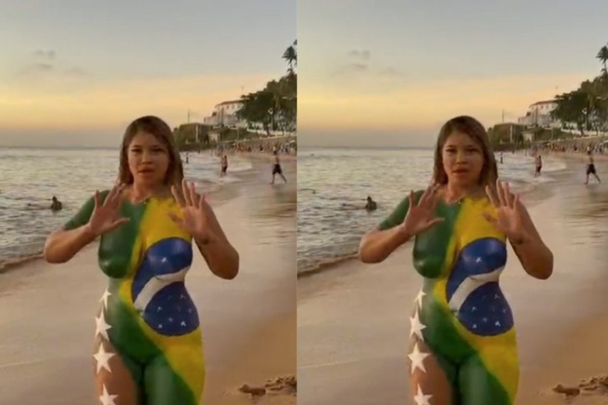 Vídeo: Mulher pintada com as cores do Brasil surpreende banhistas no Porto da Barra